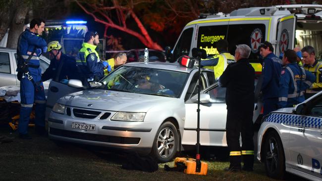 Paramedics treat the victim following the speargun attack in Avalon. Picture: Sebastien Dekker