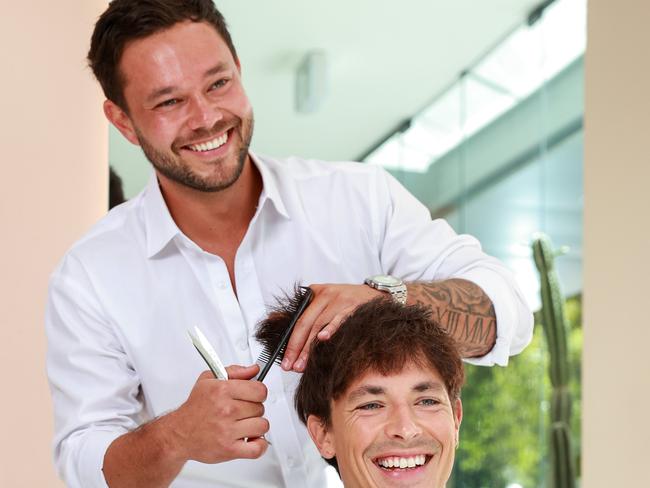 Tom Cole styles a client in his fabulous new salon.Picture: Justin Lloyd.