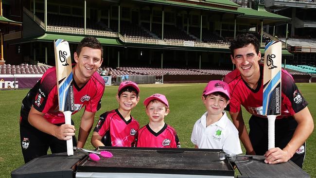 Sydney Sixers Josh Hazlewood and Mitchell Starc with young fans.