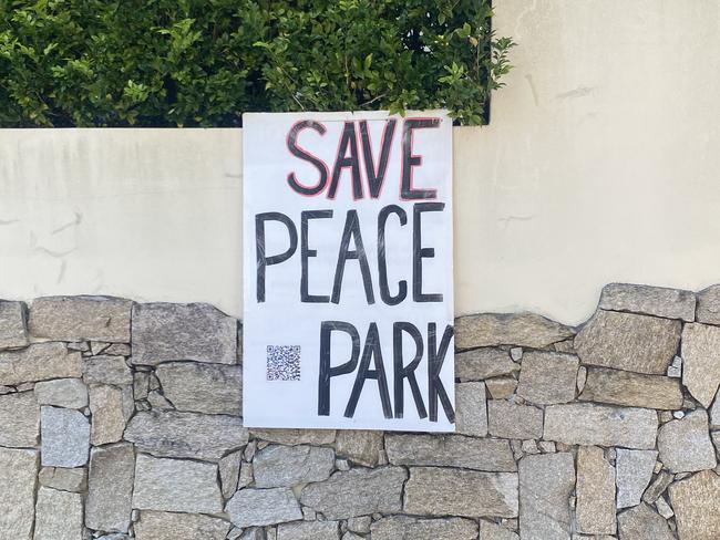 Save Peace Park signs posted around Ashbury.