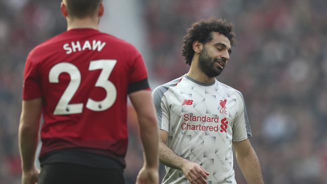 Liverpool's Mohamed Salah reacts at the end of the English Premier League soccer match between Manchester United and Liverpool at Old Trafford stadium in Manchester, England, Sunday, Feb. 24, 2019. (AP Photo/Jon Super)