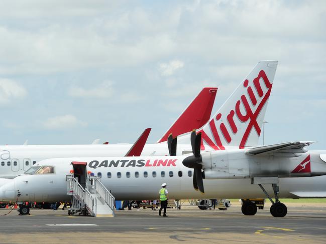 Generic photographs at Townsville Airport. A Virgin Airlines plane and a Qantas plane. Picture: Evan Morgan