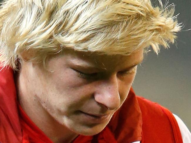 MELBOURNE, VICTORIA - MAY 09: Isaac Heeney of the Swans walks to the room on crutches afetr the round six AFL match between the Melbourne Demons and the Sydney Swans at Melbourne Cricket Ground on May 9, 2015 in Melbourne, Australia. (Photo by Darrian Traynor/AFL/Getty Images)