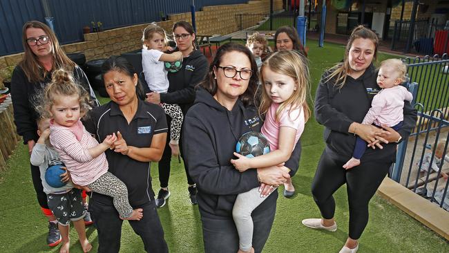 Director of Play &amp; Learn Centre in Warrane Jackie Hughes, front, with staff members and children in their care. There is increasing pressure on the childcare sector due to the COVID-19 crisis. Picture: ZAK SIMMONDS