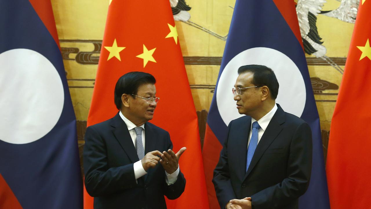 Chinese Premier Li Keqiang and Prime Minister Thongloun Sisoulith of Laos attend a document signing ceremony at Great Hall of the People on November 28, 2016. (Photo by Thomas Peter - Pool/Getty Images)