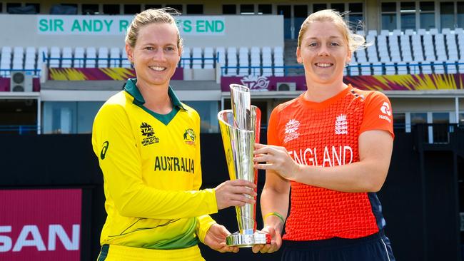 Meg Lanning (L) of Australia and Heather Knight (R) of England hold the Women's World T20 trophy at Sir Vivian Richards Cricket Ground. Picture: AFP