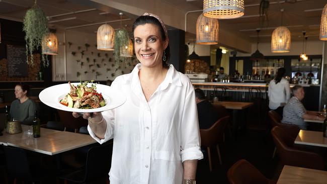 Front of house manager at Robbie Brown's at Kingston, Erin Webb with their seafood salad. Picture: Zak Simmonds