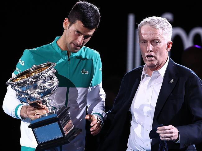 MELBOURNE, AUSTRALIA - FEBRUARY 21: Novak Djokovic of Serbia speaks with CEO of Tennis Australia Craig Tiley as he holds the Norman Brookes Challenge Cup following victory in his MenÃ¢â¬â¢s Singles Final match against Daniil Medvedev of Russia  during day 14 of the 2021 Australian Open at Melbourne Park on February 21, 2021 in Melbourne, Australia. (Photo by Cameron Spencer/Getty Images)