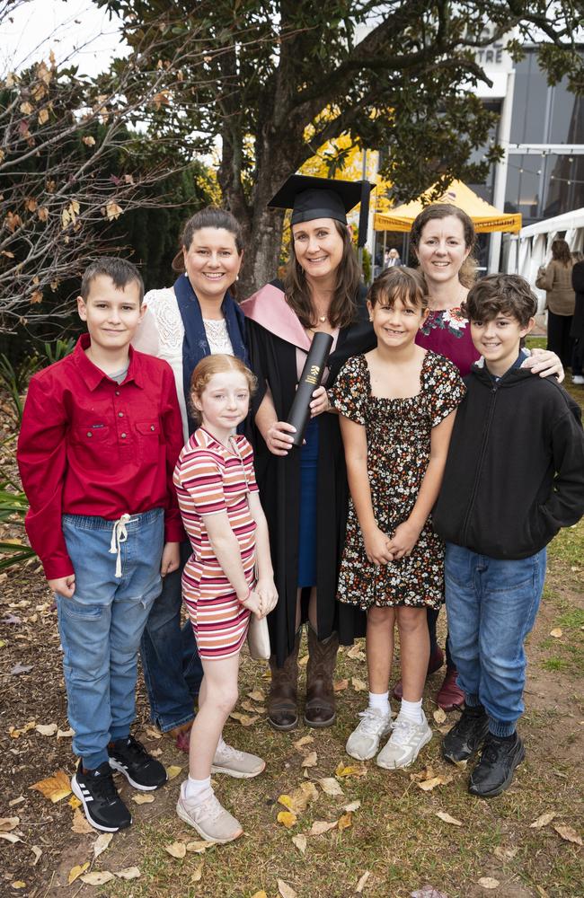 Bachelor of Education (Primary) graduate Sharon Arthur with (from left) Luke Arthur, Lucy Finney, Mya Bray, Ruby Arthur, Candice Patrick and Bailey Bray at a UniSQ graduation ceremony at The Empire, Tuesday, June 25, 2024. Picture: Kevin Farmer