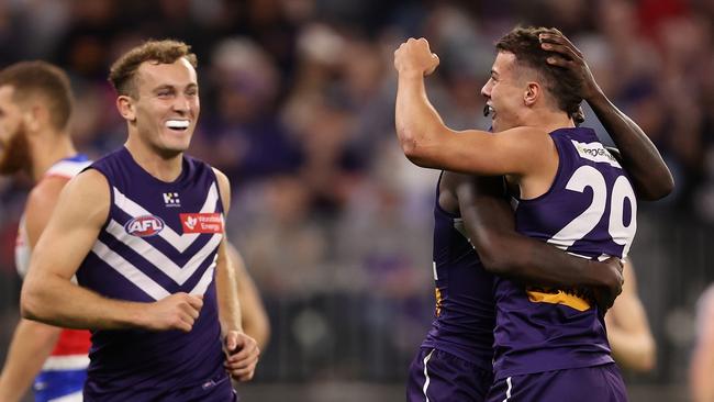 PERTH, AUSTRALIA - APRIL 27: Cooper Simpson of the Dockers celebrates a goal with Michael Frederick during the round seven AFL match between Fremantle Dockers and Western Bulldogs at Optus Stadium, on April 27, 2024, in Perth, Australia. (Photo by Paul Kane/Getty Images)