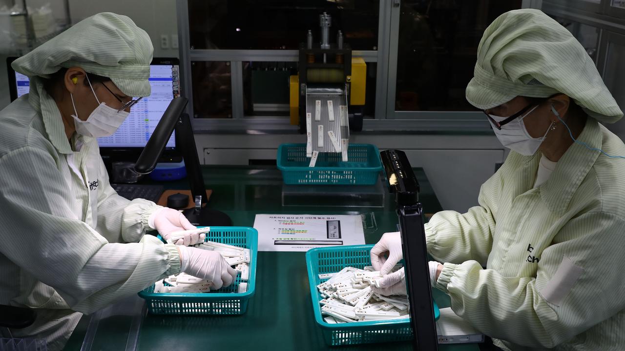 Employees work on the production line of the Ichroma COVID-19 Ab testing kit used in diagnosing the coronavirus (COVID-19) at the Boditech Med Inc. headquarters in Chuncheon, South Korea. Picture: Chung Sung-Jun/Getty Images