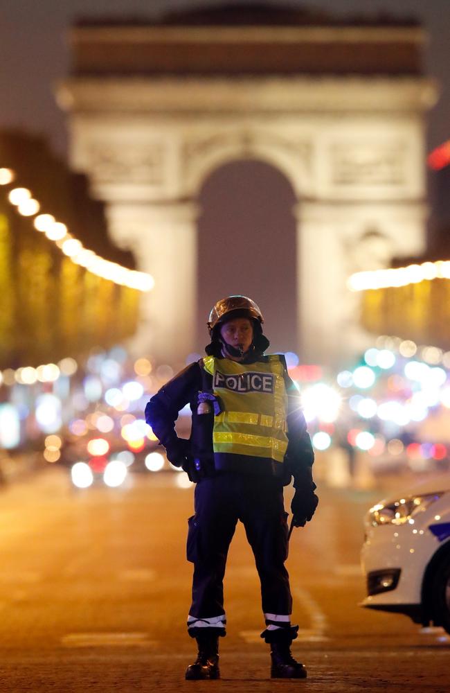 Police secure the Champs Elysees boulevard after one policeman was killed and two others wounded.