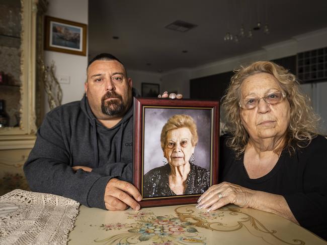 Mark Tullio and his mother Nancy hold a picture of Nancy's mother Concetta Mineo, who died at Epping Gardens. Picture: Jake Nowakowski