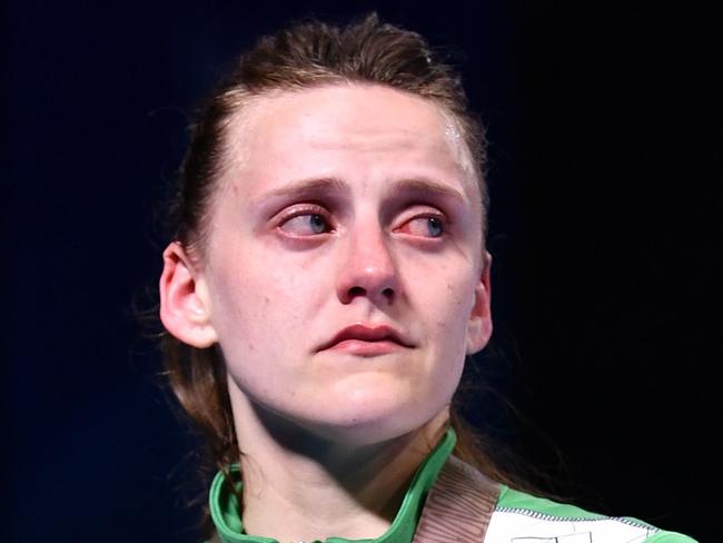 Silver medallist Northern Ireland's Michaela Walsh cries during the medal ceremony for the women's 57kg boxing event during the 2018 Gold Coast Commonwealth Games at the Oxenford Studios venue on the Gold Coast on April 14, 2018. / AFP PHOTO / Anthony WALLACE