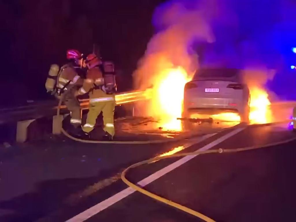 A Tesla Model 3 electric car caught fire after it hit debris from a truck in front of it near Goulburn. Picture: Supplied