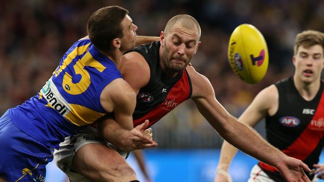 Tom Bellchambers kicks under pressure. Picture: Getty Images