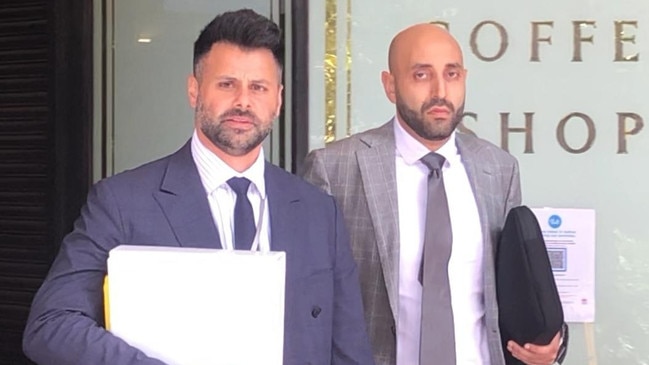 Dentist James Hanna, right, outside court with his legal team.