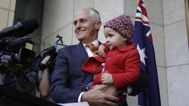 Malcolm Turnbull with his grand daughter Alice at a press conference after the leadership vote. Picture: Sean Davey