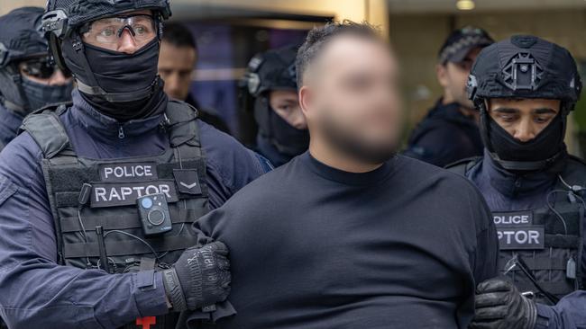 Ali Younes (centre) being arrested in Parramatta.