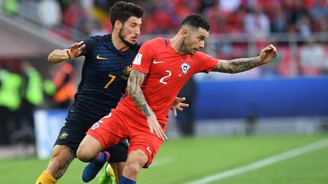 Australian forward Mathew Leckie (left) vies with Chile defender Eugenio Mena during their Confederations Cup clash this year.