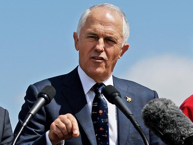 Australian Prime Minister Malcolm Turnbull (centre), with Minister for Defence, Senator Marise Payne who points at the planes (right) and Minister for Defence Industry, Christopher Pyne speak to media in front of the F-35 Joint Strike Fighter while attending the Avalon airshow to see the F35 in action at the Avalon airshow in Avalon, Melbourne, Friday, Mar. 2, 2017. (AAP Image/Tracey Nearmy) NO ARCHIVING