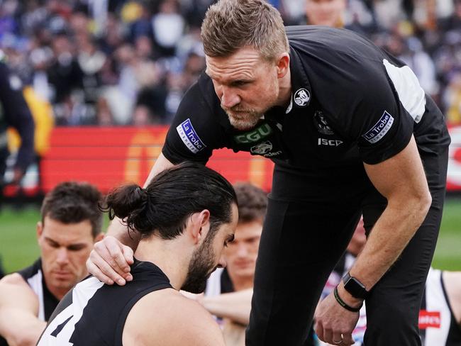 Buckley consoles Brodie Grundy after the Magpies went agonisingly close to winning the premiership in 2018. Picture: Getty Images