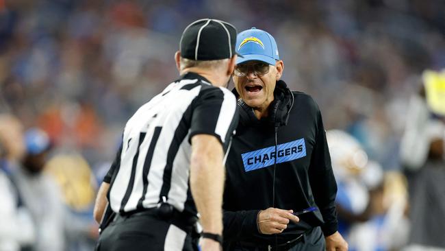 Head coach Jim Harbaugh dusted off the rule book. Ronald Martinez/Getty Images/AFP