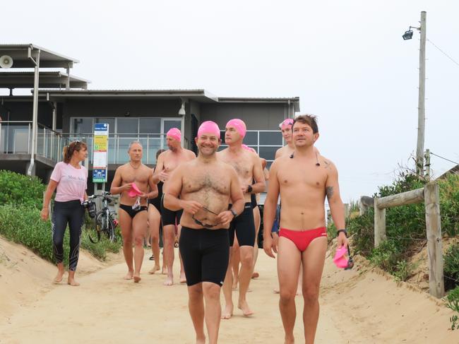 Members of the Peninsula Ocean Swimmers group get ready to attempt to swim around Lion Island. Picture: Richard Noone