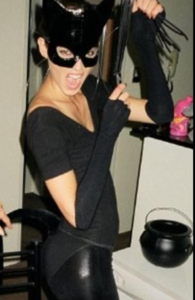 Dressing up as Catwoman.