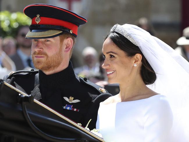 The Duke and Duchess of Sussex departed Windsor Castle for a procession through the streets. Picture: AP