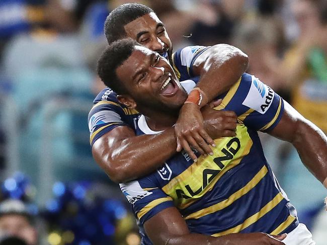 SYDNEY, AUSTRALIA - MARCH 29: Maika Sivo of the Eels celebrates with team mates after scoring a try during the round three NRL match between the Parramatta Eels and the Sydney Roosters at ANZ Stadium on March 29, 2019 in Sydney, Australia. (Photo by Matt King/Getty Images)