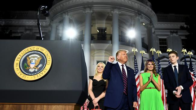 First Lady Melania Trump, Barron Trump and Tiffany Trump stand with US President Donald Trump as he pumps his fist after he delivered his acceptance speech for the Republican Party nomination for re-election. Picture: AFP