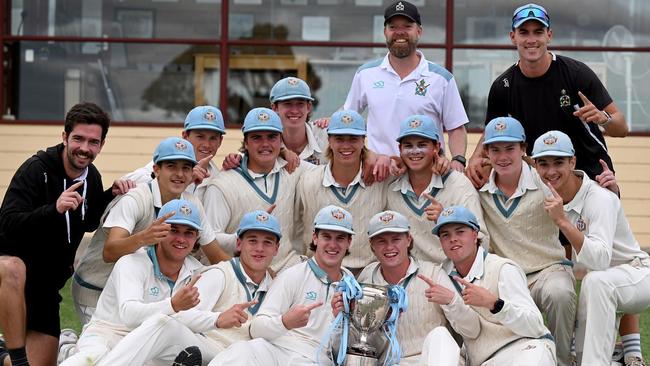 Geelong Grammar celebrating their APS cricket premiership. Pictured is co-coach Matt Gunther, teacher in charge of cricket Jye Hearps, assistant coach Charles McCartin and the players. Picture: Geelong Grammar