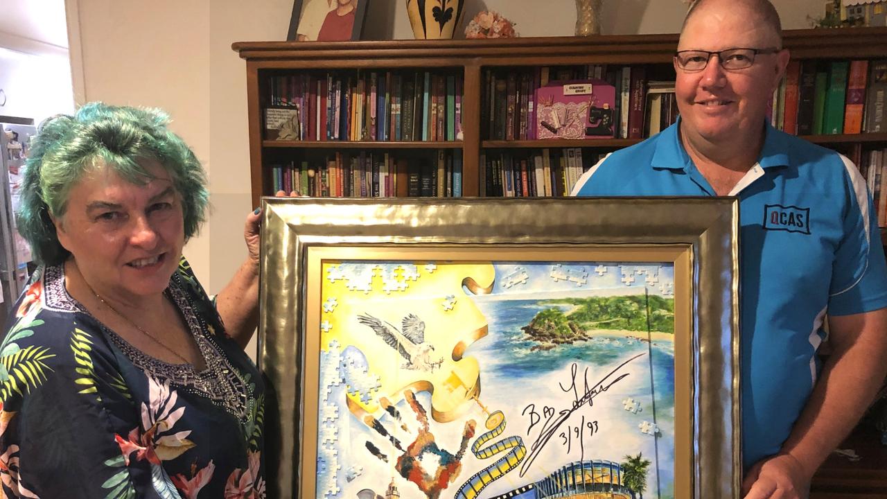 SOLD: Toowoomba art collector Dale Miller (right) snapped up former Gatton artist Sharon Davson's Journeys in Belonging piece for $125,000, after the artwork was languishing in the store rooms of the Port Macquarie art gallery.