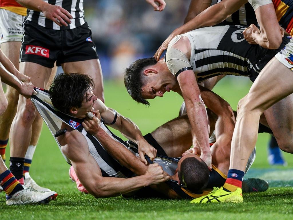 Zak Butters and Connor Rozee get stuck into Josh Rachele. Picture: Mark Brake/Getty Images