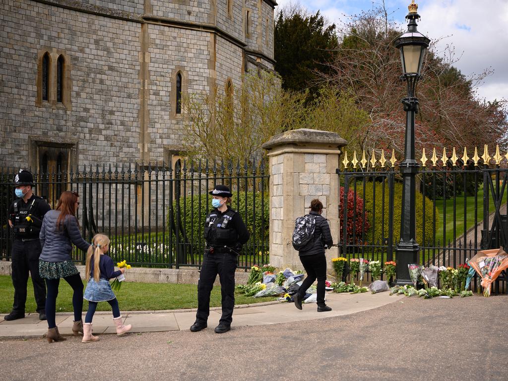 People arrived at Windsor Castle to lay flowers down for Prince Philip. Picture: Getty Images