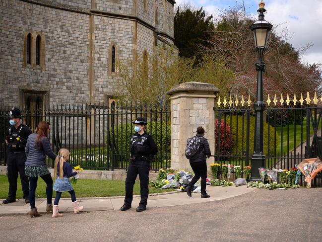 People arrived at Windsor Castle to lay flowers down for Prince Philip. Picture: Getty Images