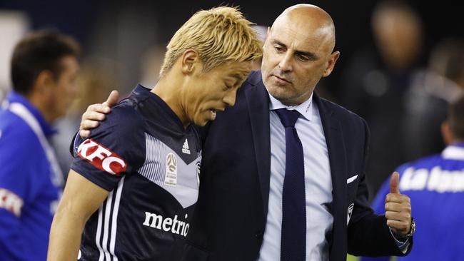 Coach Kevin Muscat of the Victory (right) speaks with Keisuke Honda of the Victory after the Round 20 A-League match between Melbourne Victory and Melbourne City at Marvel Stadium in Melbourne, Saturday, February 23, 2019. (AAP Image/Daniel Pockett) NO ARCHIVING, EDITORIAL USE ONLY