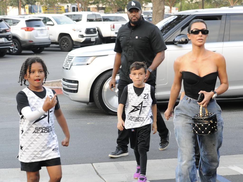 The boy made a rude gesture to photographers. Picture: Splash News/Media Mode