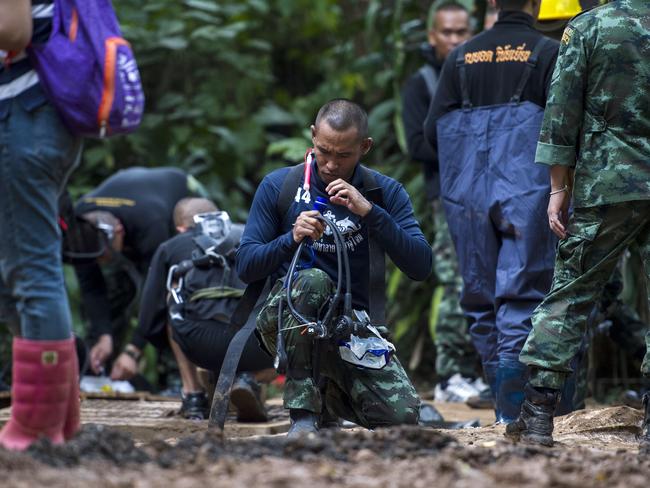 Divers are preparing at the site while the boys are taught to use scuba gear underground. Picture: Ye Aung Thu/AFP