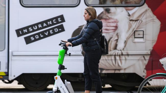 People riding scooters in MelbourneÃ¢â¬â¢s CBD without wearing helmets. Hospitals are reporting high levels of scooter injuries. Picture: Ian Currie