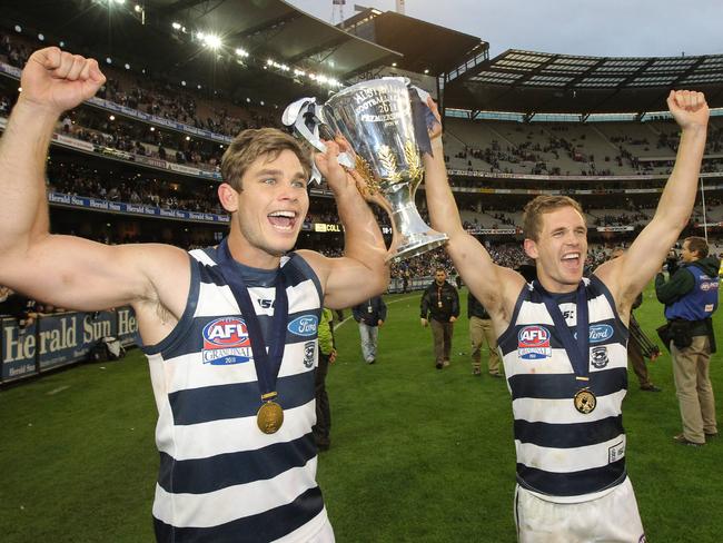 Tom Hawkins and Joel Selwood with premiership cup in 2011.