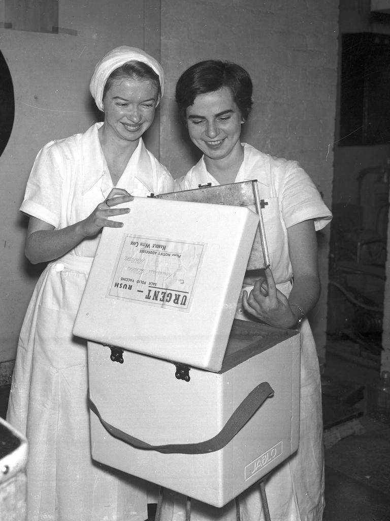 Special containers for Salk anti-polio vaccine being checked in Brisbane by laboratory assistants Ruth Rogers, left, of Mackay, and Una Bonner of Chelmer in readiness for a State-wide vaccination campaign in 1956. Picture: Ray Saunders