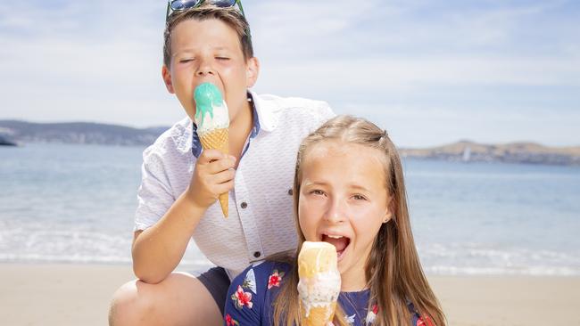 Siblings Hudson Bernes, 10, and Taylah Bernes, 13, enjoy ice creams at Long Beach Sandy Bay. Picture: RICHARD JUPE