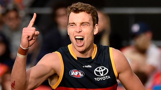 GOLD COAST, AUSTRALIA - JUNE 19: Riley Thilthorpe of the Crows celebrates kicking a goal during the round 14 AFL match between the Gold Coast Suns and the Adelaide Crows at Metricon Stadium on June 19, 2022 in Gold Coast, Australia. (Photo by Matt Roberts/AFL Photos/Getty Images)