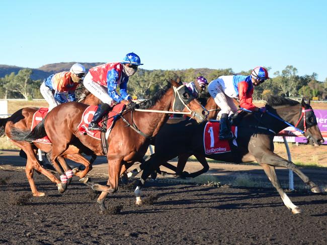 Lotion (jockey Paul Shiers on the outside) moments before winning the 2020 Alice Springs Cup for trainer Angela Forster. Picture: NIKKI WESTOVER