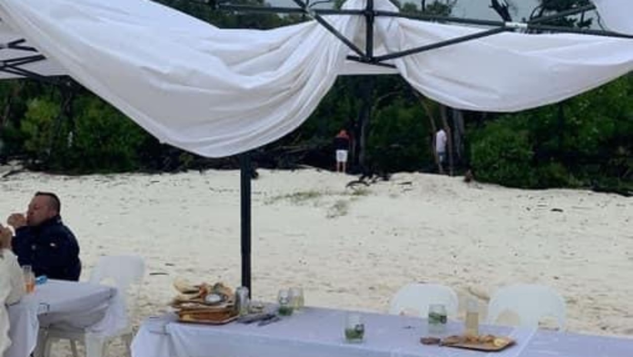 Unsatisfied attendees of the White On Whitehaven Long Lunch shared this image showing marquees damaged by torrential rain and extreme winds and men going to the toilet in view of diners. Picture: Supplied.