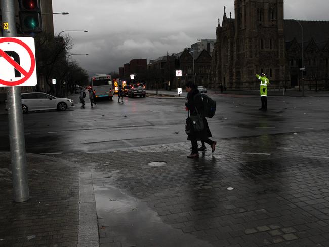 Police directing traffic in the city. Picture: Emma Brasier
