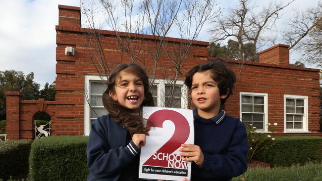 Miranda, 7, and Jeremy, 5, advocate for a new school in Albert Park.