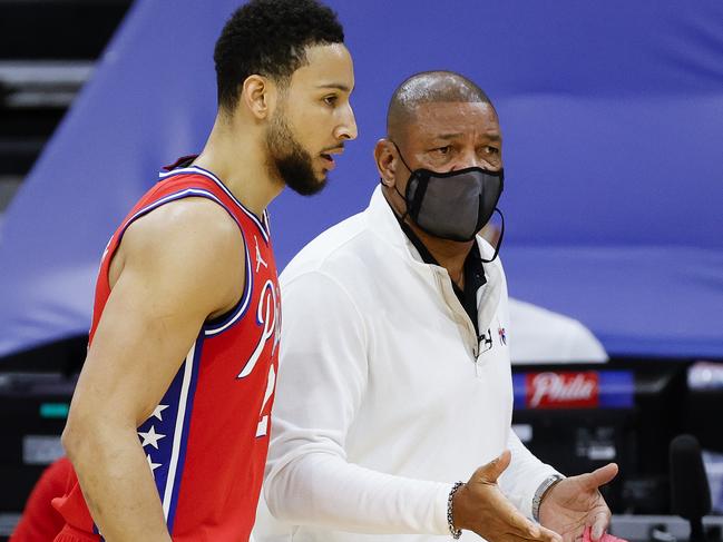 PHILADELPHIA, PENNSYLVANIA - JANUARY 27: Head coach Doc Rivers of the Philadelphia 76ers speaks with Ben Simmons #25 during the first quarter against the Los Angeles Lakers at Wells Fargo Center on January 27, 2021 in Philadelphia, Pennsylvania. NOTE TO USER: User expressly acknowledges and agrees that, by downloading and or using this photograph, User is consenting to the terms and conditions of the Getty Images License Agreement. (Photo by Tim Nwachukwu/Getty Images)